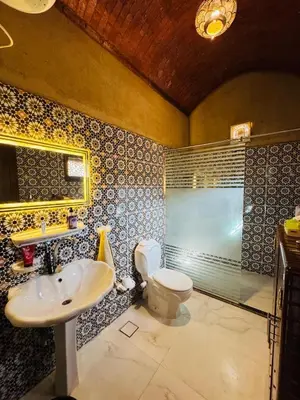 a bathroom with a sink and a toilet at Lovely Private Villa in Luxor