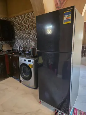 a refrigerator in a kitchen with a washing machine at Lovely Private Villa in Luxor