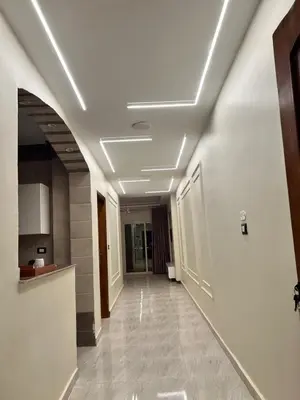 a hallway in a building with a white ceiling at ElMena House Luxor in Luxor