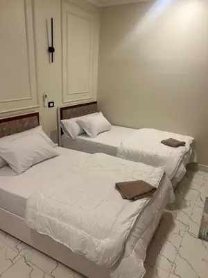 two beds sitting next to each other in a room at ElMena House Luxor in Luxor