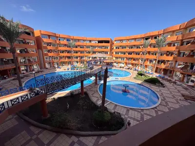 an overhead view of an apartment complex with two pools at شاليه اوزيس Oasis Chalet in New cairo