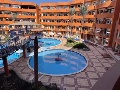 an overhead view of a swimming pool in a hotel at شاليه اوزيس Oasis Chalet in New cairo