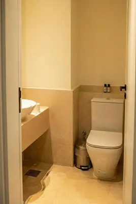 a bathroom with a toilet and a sink at Ancient Sands El Gouna Hurghada in Hurghada