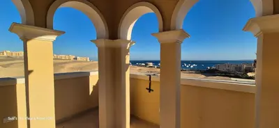 a view of the desert from a balcony of a building at Modern studio with sea view und large roof terrace in Hurghada