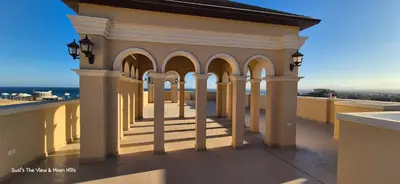 a building with columns and arches on a roof at Modern studio with sea view und large roof terrace in Hurghada