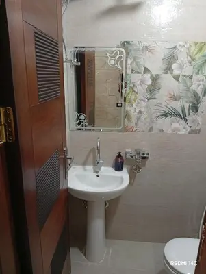 a bathroom with a sink and a mirror at Sugar Nubian Guest House Nile Vew in Aswan