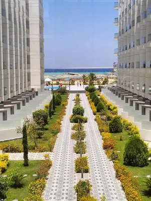 a walkway in the middle of a building at One bedroom Chalet Scandic Resort Hurghada in Hurghada