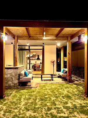 a patio with two couches and a table at Luxury 1 BR apartment with garden, Mesca - Somabay in Hurghada