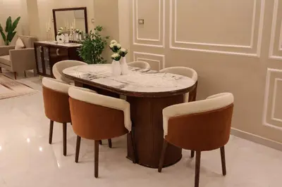 a dining room with a table and chairs at Cozy Luxe Apartment in Central Aswan in Aswān
