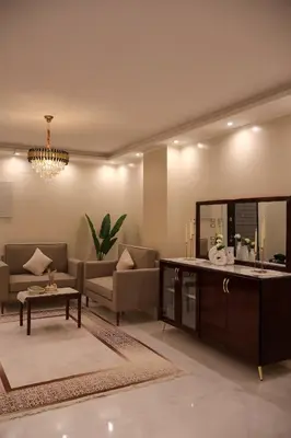 a living room with a couch and a table at Cozy Luxe Apartment in Central Aswan in Aswān