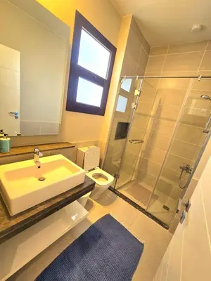 a bathroom with a sink and a shower at El Gouna Cyan the Range 4BDs Villa with private Pool in Hurghada