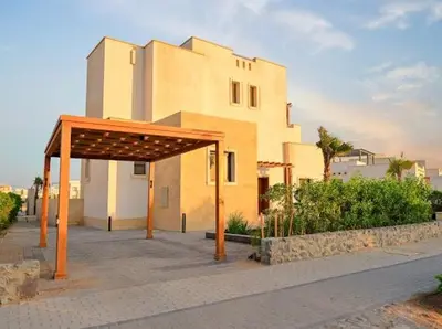 a building with a pavilion in front of it at El Gouna Cyan the Range 4BDs Villa with private Pool in Hurghada
