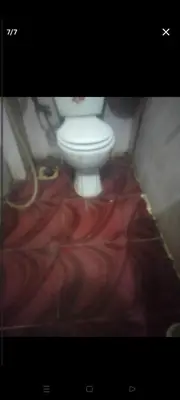 a bathroom with a white toilet in a room at قنا الشؤن in Qena