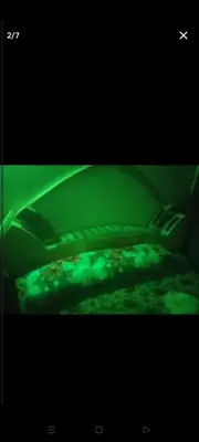 a green light on top of a bed at قنا الشؤن in Qena