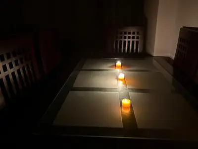 a dark room with two candles on the floor at Amaizing 2BR Apartment B2 in Turtles Beach - Hurghada in Hurghada