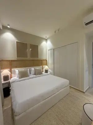 a bedroom with a large white bed in a room at Ancient Sands Resort Gouna 1 Bedroom apartment with open view in Hurghada