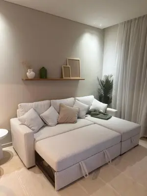 a living room with a white couch in a room at Ancient Sands Resort Gouna 1 Bedroom apartment with open view in Hurghada