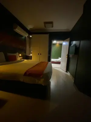 a bedroom with a large bed in a room at Nile Plaza Suites in Aswan