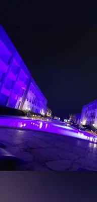 a lit up building with purple lights at night at Cecelia Resort in Hurghada