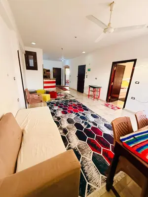 a living room with a couch and a table at Luxor Old nile apartment in Luxor
