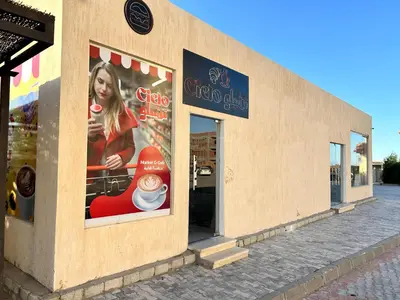 a store with posters on the side of a building at El Saraya Resort Chalet, Sahl Hasheesh in Hurghada