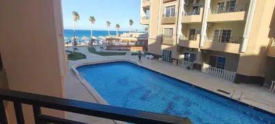 a view of a swimming pool from a balcony of a hotel at Juliana Beach Resort Hurghada AG10 in Hurghada