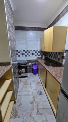 a kitchen with a sink and a counter top at Saint charbel in Hurghada