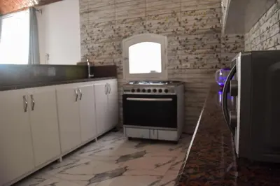 a kitchen with a stove and a window at Isis Magic House in Luxor