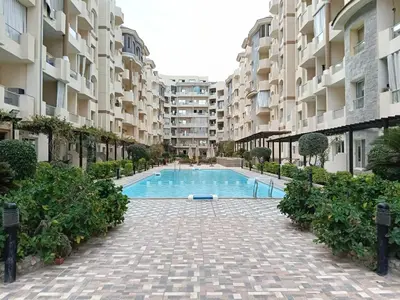 a swimming pool in the middle of a building at فلورانزا خمسين b06 in Hurghada