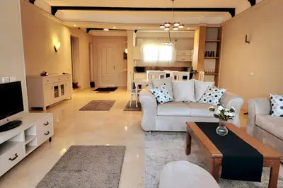 a living room with a couch and a table at Luxury Red Sea Villa in Hurghada