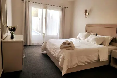 a bedroom with a bed with two towels on it at Luxury Red Sea Villa in Hurghada