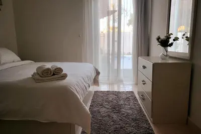 a bedroom with a bed with two towels on it at Luxury Red Sea Villa in Hurghada