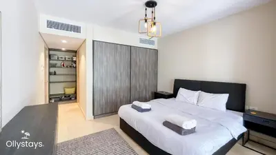 a bedroom with a bed with two towels on it at Ollystays Mangroovy 2 BR Beach and Pool Free access in Hurghada