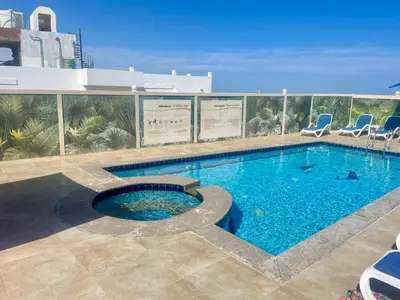 a swimming pool on top of a building at Elegant one bedroom apartment managed by Lilly Homes in Hurghada
