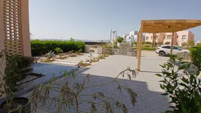 a parking lot with a car parked in it at Ollystays Ancient Hill 4BR Villa Private Pool in Hurghada