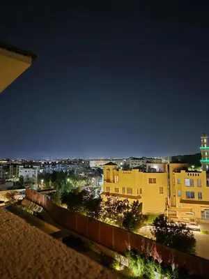 a view of a city at night with buildings at Alday gorizont in Hurghada