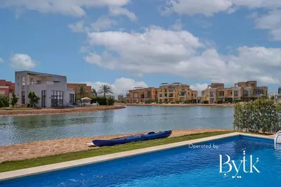a swimming pool in the middle of a river with buildings at BYTK - Casa De Familia in Hurghada