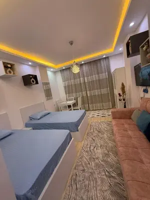 a bedroom with two beds and a couch at Touristic centre beach2 in Hurghada