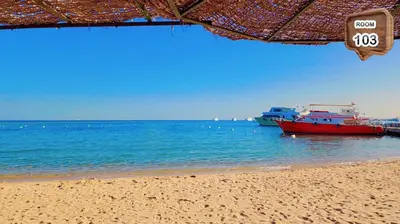 two boats in the water on a beach at Touristic centre beach2 in Hurghada