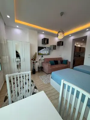a bedroom with a bed and a living room at Touristic centre beach2 in Hurghada