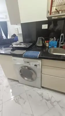 a kitchen with a washing machine and a sink at Juliana beach resort in Hurghada