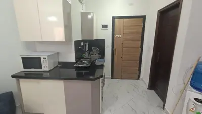 a kitchen with a counter top and a microwave at Juliana beach resort in Hurghada