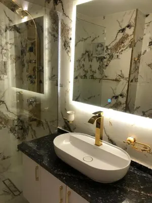 a bathroom with a sink and a mirror at New Marina Deluxe in Hurghada