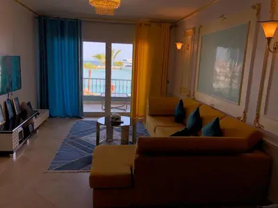 a living room with a couch and a table at New Marina Deluxe in Hurghada
