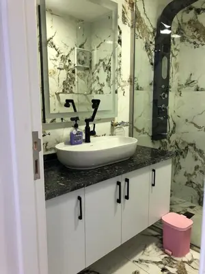 a bathroom with a sink and a mirror at New Marina Deluxe in Hurghada