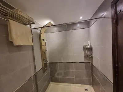a shower with a glass door in a bathroom at Oasya Studio Hurghada in Hurghada