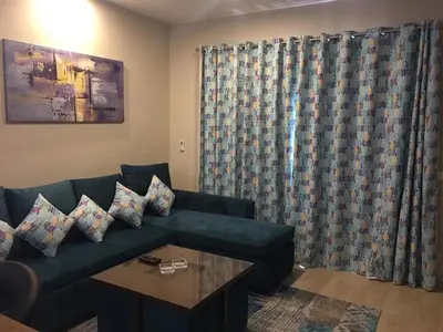 a living room with a couch and a table at Sabina Comfort Residence in Hurghada