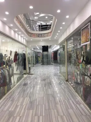 a shopping mall with a large room with glass windows at Large Nile View apartment 2 Rooms Air-con Downtown in Aswan