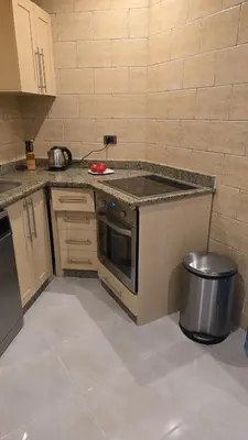 a kitchen with a stove and a counter top at Ferienwohnung Sahl Hasheesh in Hurghada