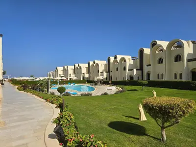a large building with a lawn in front of a resort at Ferienwohnung Sahl Hasheesh in Hurghada